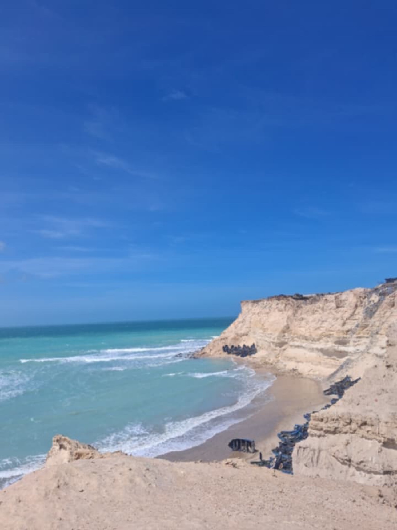 Rocky cliff and beach by the sea