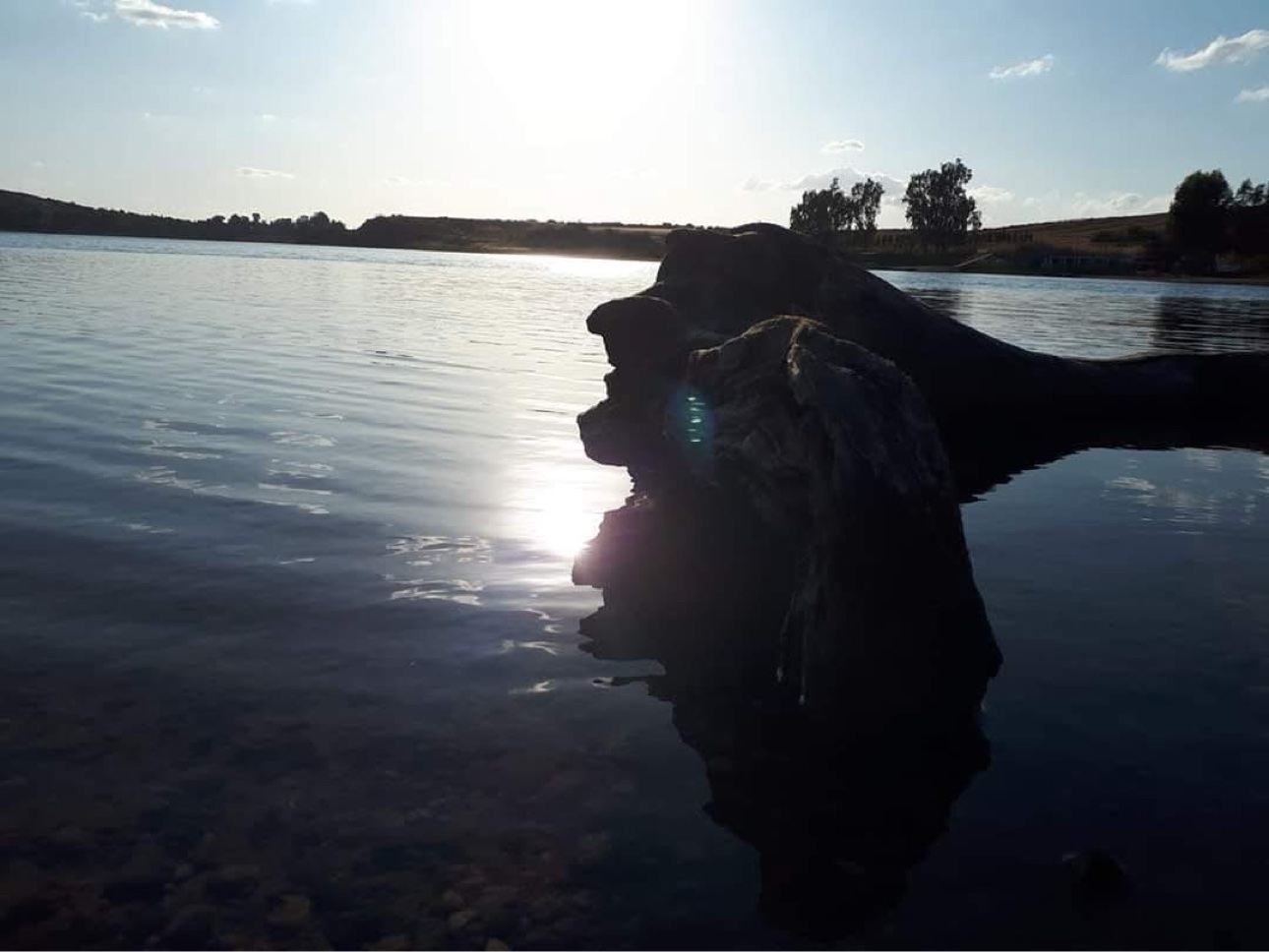 Rock formation rising from the water